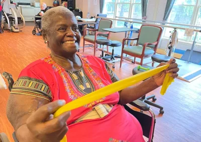 Resident using a yellow fitness band